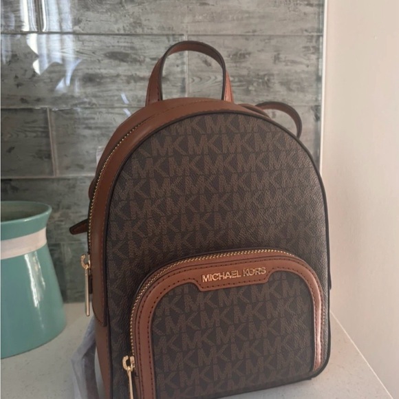 Michael Kors Handbags - Michael Kors Signature Brown Backpack